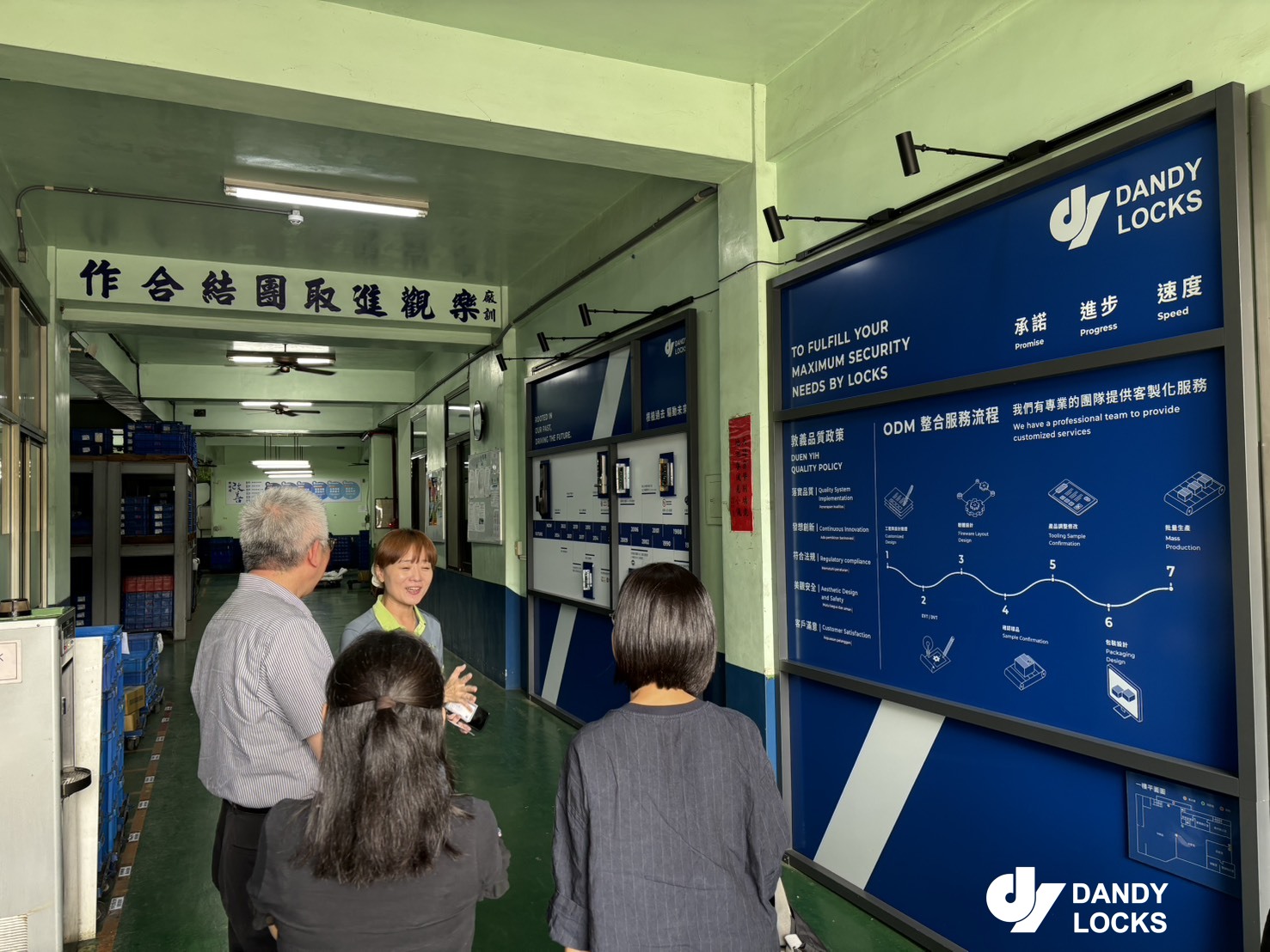 T22 visit participants reviewing internal process boards at Duen Yih Metal